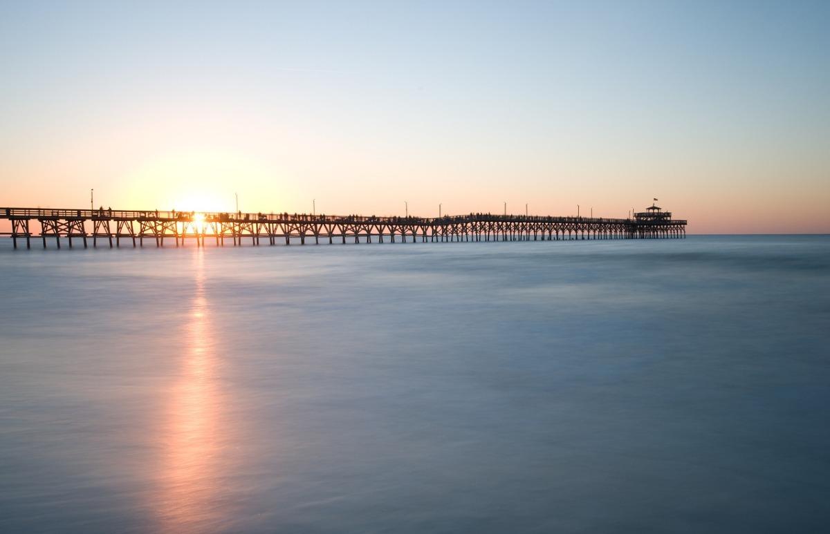 the Cherry Grove Fishing Pier in North Myrtle Beach at sunrise.