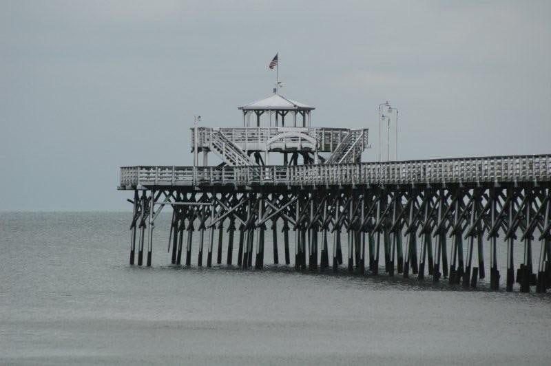 a black and white photo of the cherry grove pier