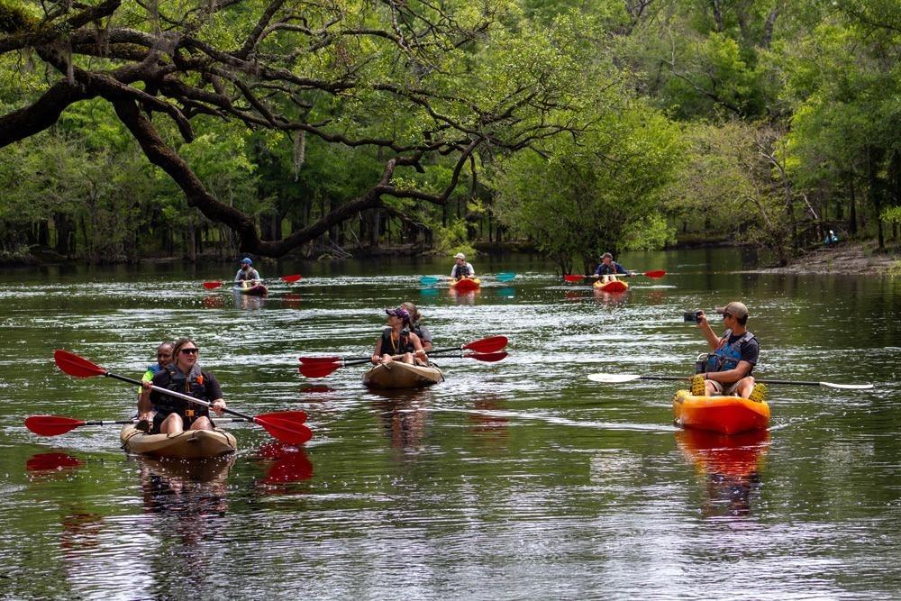 a group of kayakers on the waccamaw river